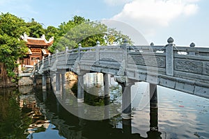 Thuy Trung Tien temple with stone bridge on Thanh Nien street in Hanoi, Vietnam