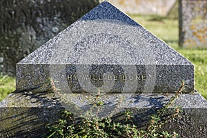 Thy will be done. Religious text inscription on graveyard tombstone.