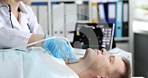 Thyroid scan on ultrasound scanner machine in hospital for patient