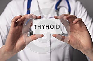 Thyroid word, inscription in doctor hands close up