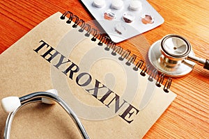 Thyroxine hormone in the notepad and stethoscope