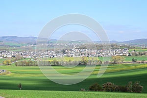 ThÃ¼r, Germany - 04 23 2021: Green Eifel valley in spring with the village ThÃ¼r and Obermendig in background