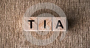 TIA Transient Ischemic Attack acronym in cubes on wooden background