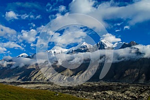 Tian Shan mountains snow peaks and clouds panorama