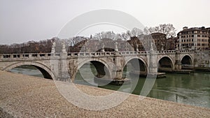 Tiber river with the Angel bridge in Rome, Italy