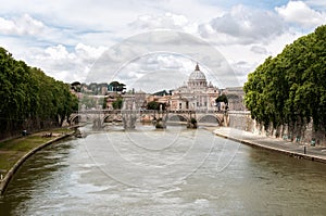 The Tiber River with St. Peters basilica in the ba