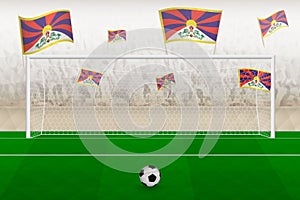 Tibet football team fans with flags of Tibet cheering on stadium, penalty kick concept in a soccer match