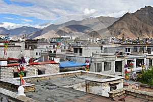 Tibet, view for the roofs of buildings in Lhasa in cloudy summer day