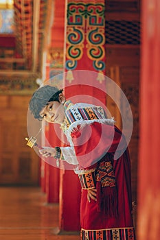 Tibetan boy holding prayer wheel