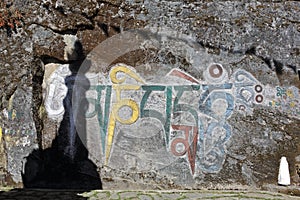 Tibetan Buddhist mantras on the rock photo