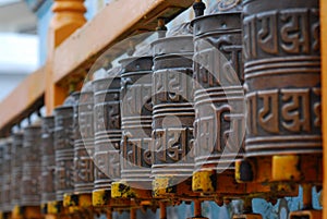 Tibetan Buddhist Prayer Wheels In A Row