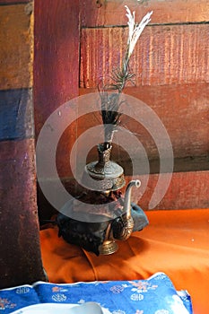 Tibetan Buddhist still life - water vessel. Hemis gompa, Ladakh, India.