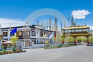 Tibetan buildings of CHAMBA Hotel and Restaurant in front of Thiksey Monastery or Thiksey Gompa, A famous Tibetan temple in Ladakh photo