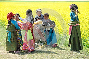 Tibetan children in seed field