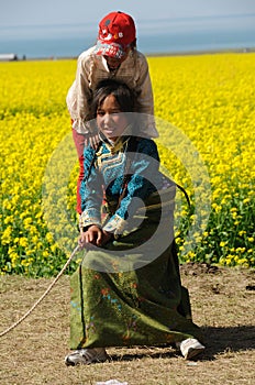 Tibetan children in seed field