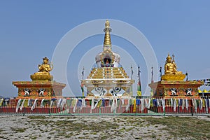 Tibetan chorten with seated Buddha in center, flanked by statues of Avalokiteshvara (Chenrezig) and Padmasambhava, Nepal