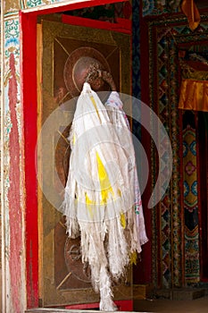 Tibetan door with hada scarf photo