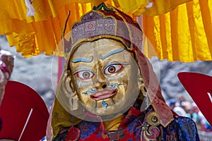 Tibetan man, dressed in a mystical mask, perform a dance during the Buddhist festival in Hemis monastery, Ladakh, India