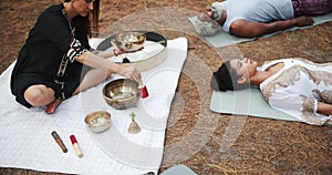 Tibetan, meditation and people outdoor with sound for indigenous spiritual healing in holistic practice. Soul, music and