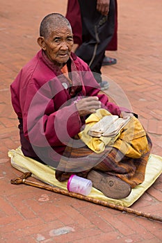 Tibetan monk reading a old tibetan manuscript