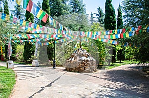 Tibetan pile of stones with colorful Tibetan prayer flags