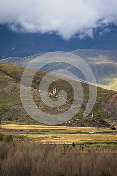 Tibetan Plateau mountain landscape with clouds and trees