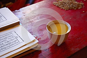 Tibetan prayer book and salt tea