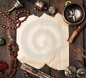 Tibetan religious objects for meditation and alternative medicine, empty brown sheet of paper