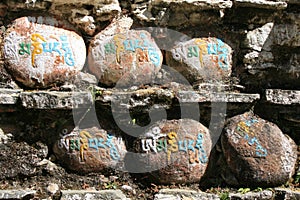 Tibetan signs are engraved on stones in Bhutan
