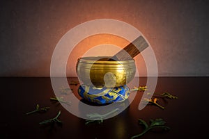 Tibetan singing bowl in golden backlight