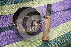 Tibetan singing bowl with stick top view