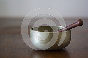 Tibetan Singing Bowl on wooden table