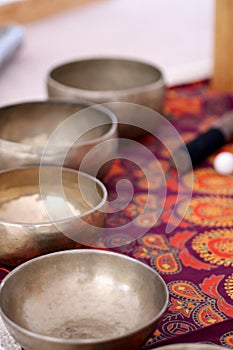 Tibetan singing bowls close up for a sound healing therapy session.