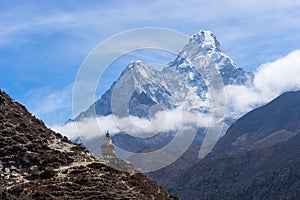 Tibetan stupa and Ama Dablam mountain peak, Everest region