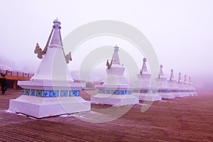 Tibetan stupas in heavy fog