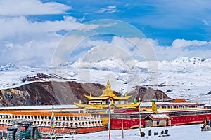 Tibetan temple under the snow mountain