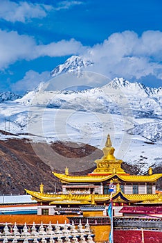 Tibetan temple under the snow mountain