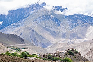 Tibetan village and Dhaulagiri mountain range on background.