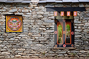 Tibetan window on the rock wall