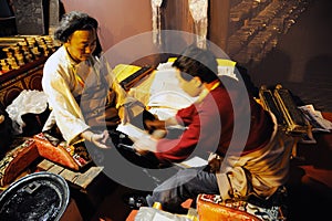 Tibetan workers printing an sutras