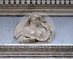 Tiburtine Sibyl, relief on the portal of the Cathedral of Saint Lawrence in Lugano