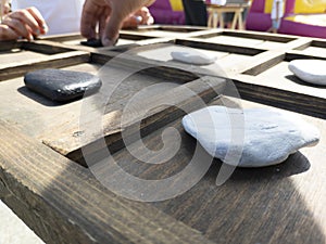 tic-tac-toe game made with wood and stones