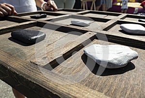 tic-tac-toe game made with wood and stones