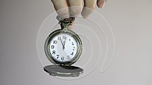 Tick tock the clock is ticking 5 minutes to 12 o`clock photo