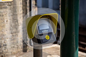 A ticket or travel card scanner point on a train station platform