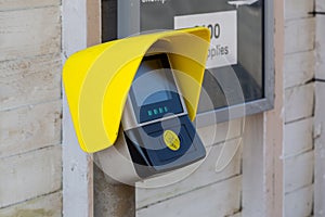 A ticket or travel card scanner point on a train station platform photo