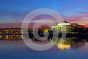Tidal Basin panorama at dawn with Thomas Jefferson Memorial during cherry blossom festival in Washington DC, USA.