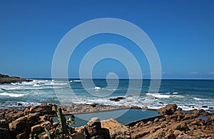 TIDAL POOL IN THE OCEAN