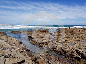 The tidal pools at Kilcunda Beach in Victoria, Australia with the tide coming in