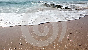 Tidal water waves at Carcavelos beach, Portugal